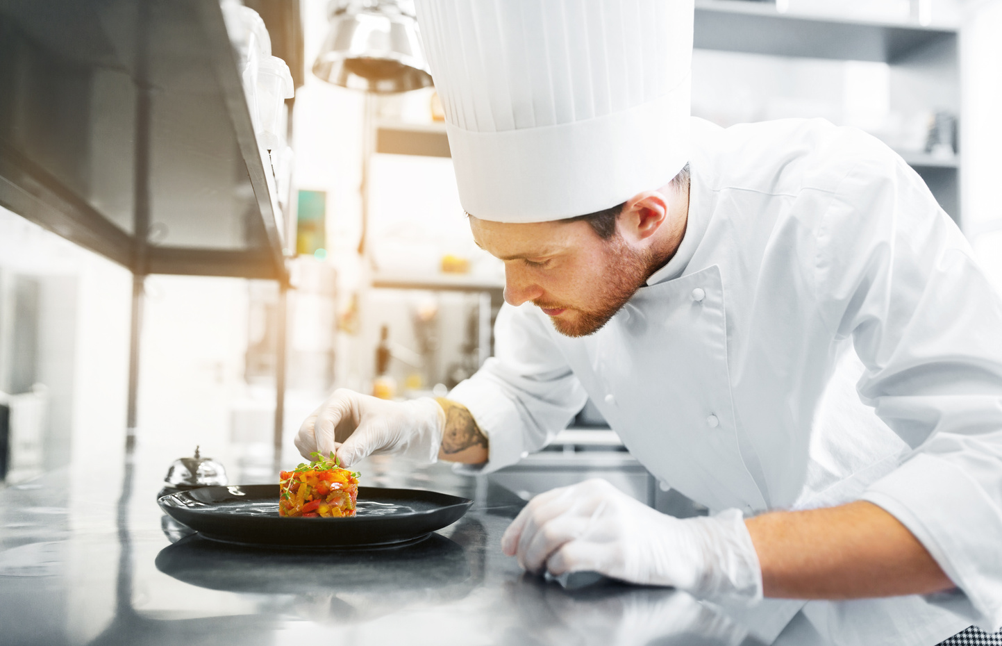 Happy Male Chef Cooking Food at Restaurant Kitchen