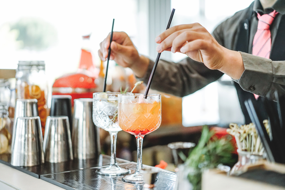 Bartender Mixing Different Cocktails 